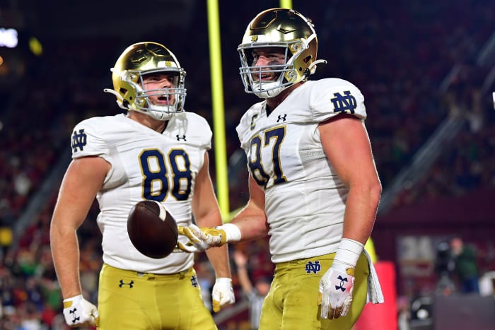 Notre Dame Fighting Irish tight end Michael Mayer (87) celebrates his touchdown scored against the Southern California Trojans with tight end Mitchell Evans (88) during the first half at the Los Angeles Memorial Coliseum.